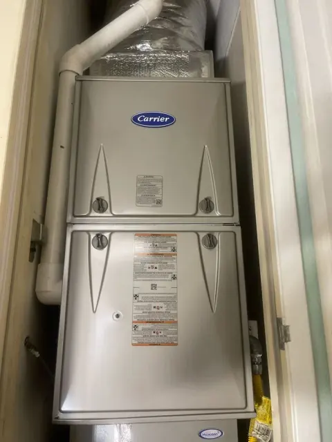 Carrier furnace and indoor coil installed vertically inside a utility closet in Berkeley