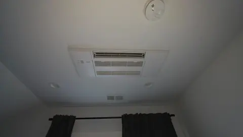Mitsubishi Electric ceiling cassette unit recessed into a bedroom ceiling in Piedmont
