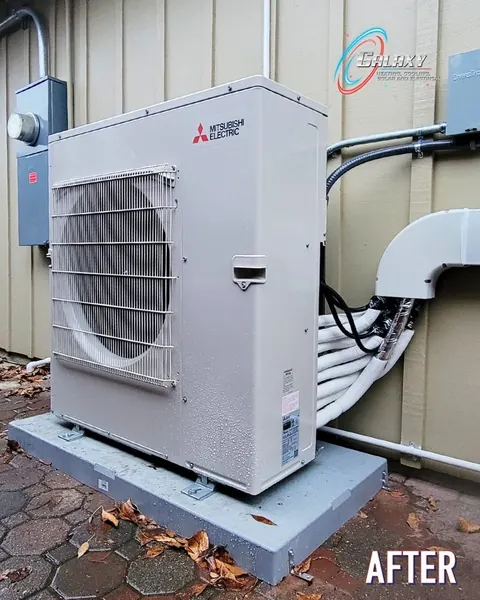 Mitsubishi Electric single-fan outdoor unit on a pad with a covered line-set route in Walnut Creek