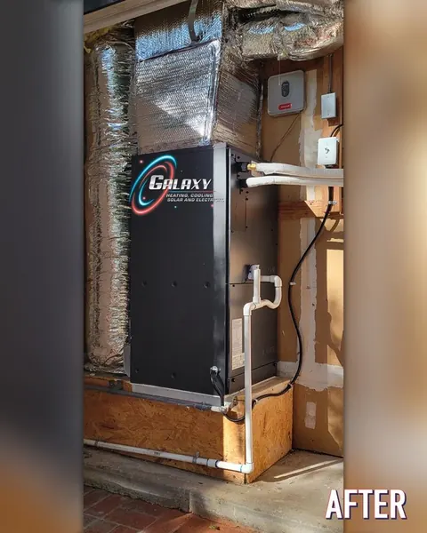 Vertical air handler with foil-faced ductwork above a raised platform in San Francisco