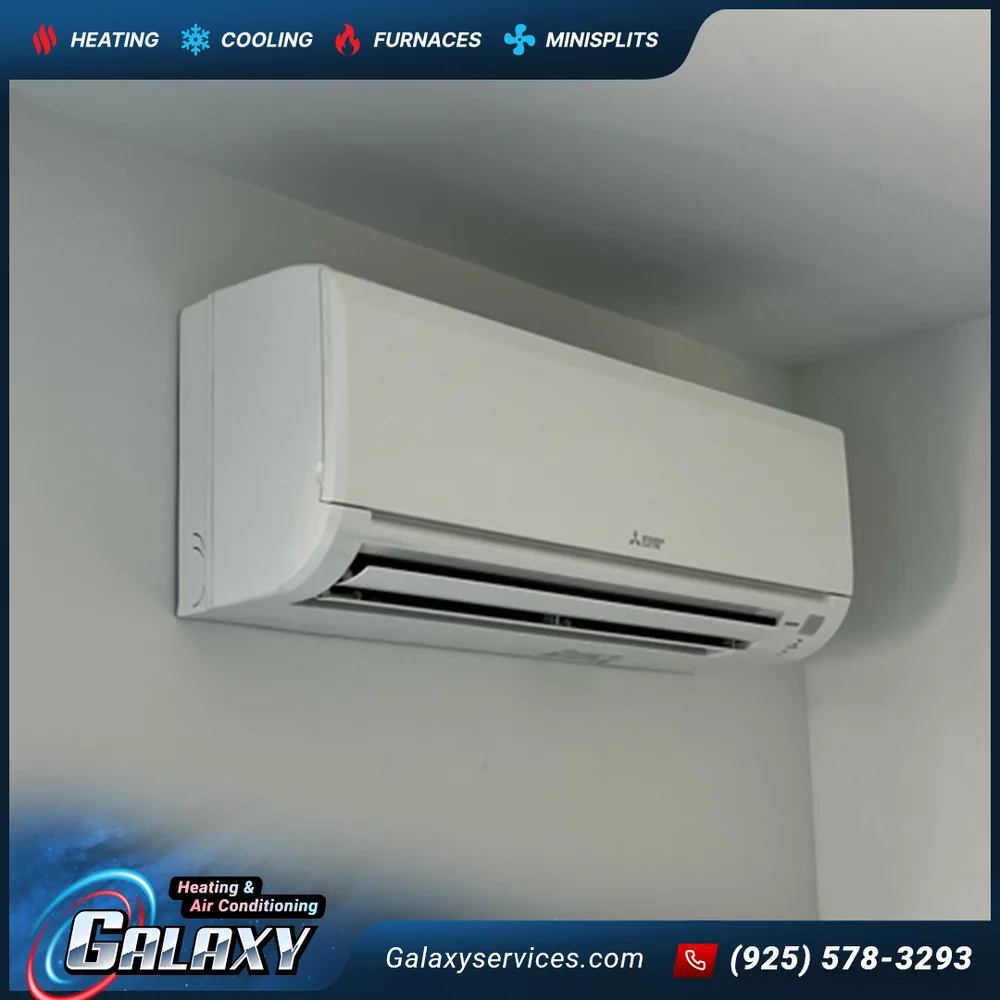 Close-up of a white ductless indoor unit mounted high on an interior wall in Pleasanton