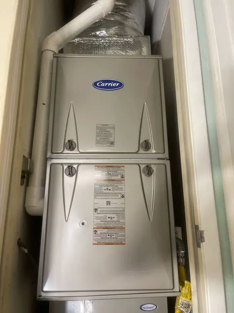 Carrier furnace and indoor coil installed vertically inside a utility closet in Berkeley