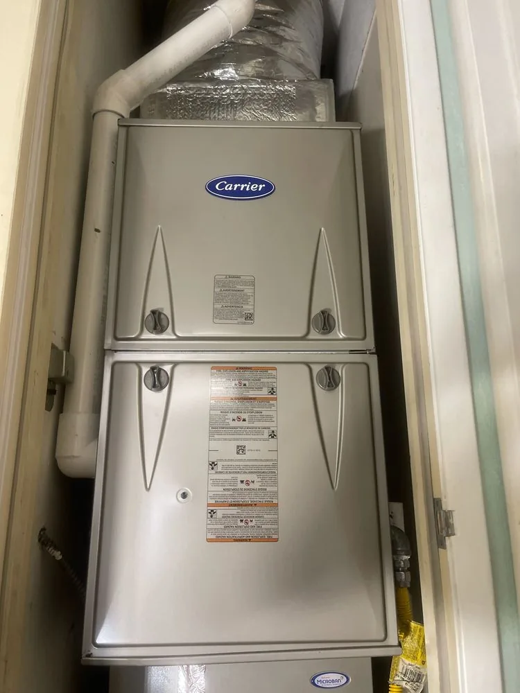 Carrier furnace and indoor coil installed vertically inside a utility closet in Berkeley