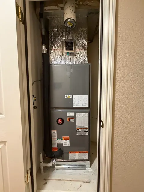 Rheem air handler in a Dublin closet with insulated ductwork and an air-treatment device in Dublin