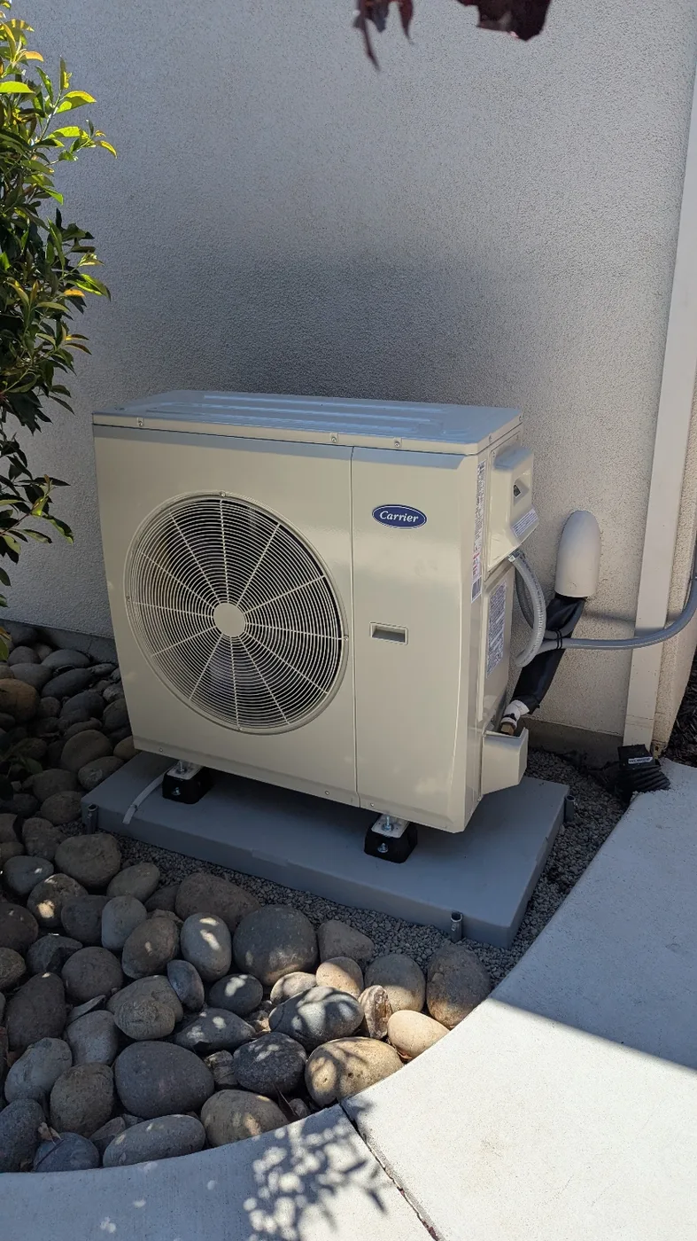 Carrier side-discharge outdoor heating and cooling unit installed at a Brentwood home
