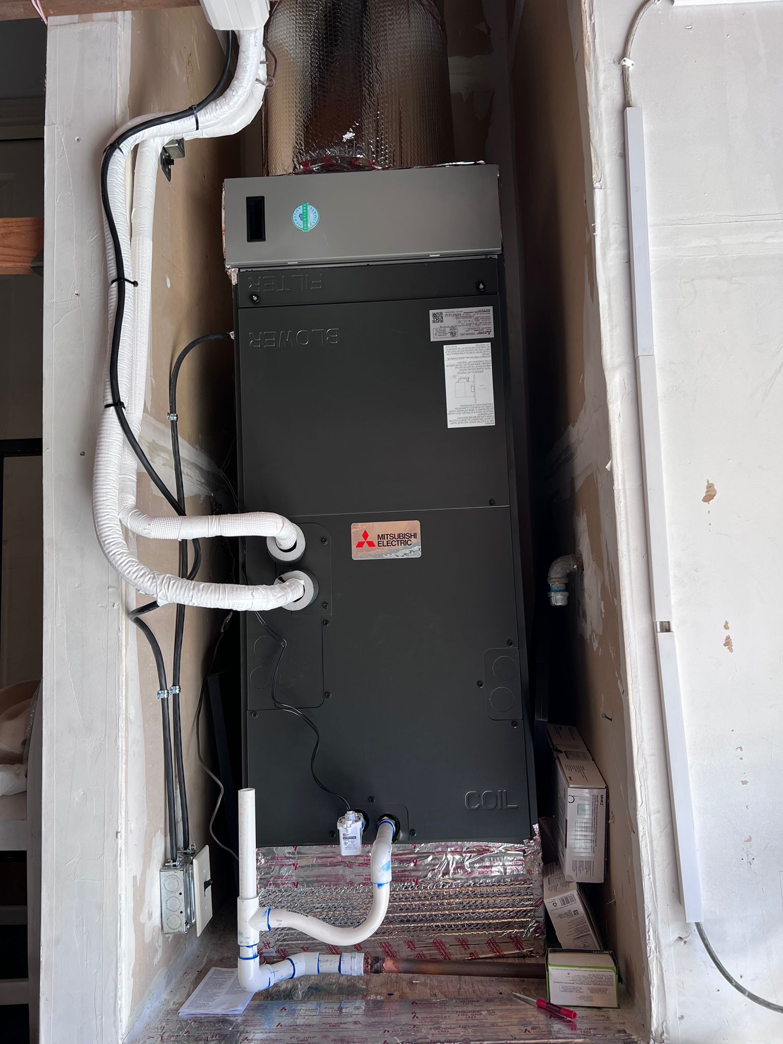 Mitsubishi Electric vertical air handler installed by Galaxy Heating & Air in a closet at a Lower Hillsborough home